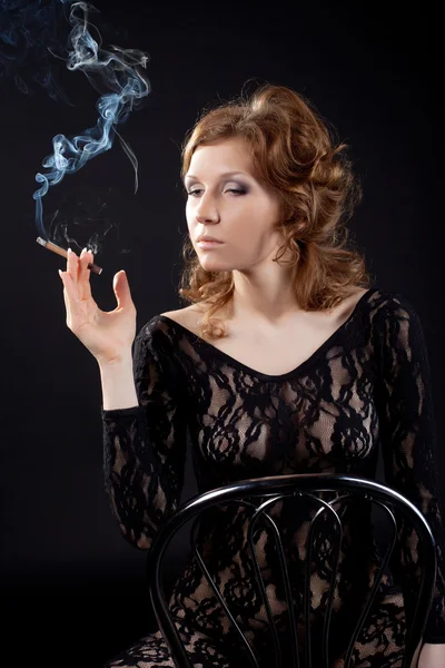 stock image Sexy woman in black lace body shirt smoke in dark