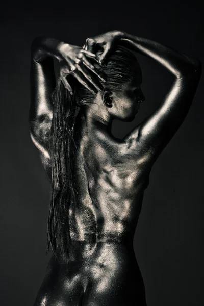 stock image Nude woman like statue in liquid metal
