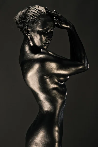 stock image Nude woman like statue in liquid metal