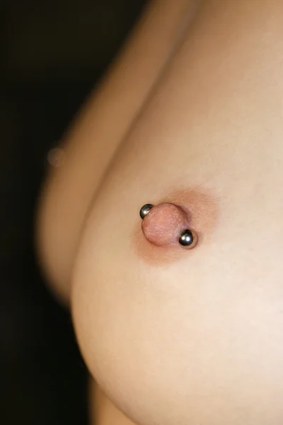 Stock image Pierced nipples.