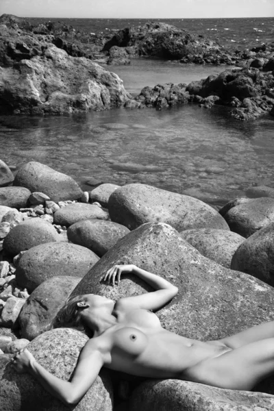 stock image Nude woman on rocks.