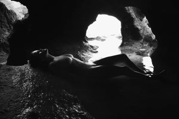 stock image Nude woman in cave.