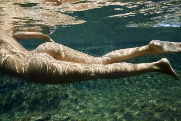 Stock image Nude woman underwater.